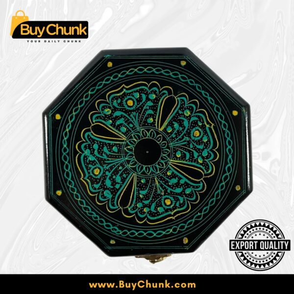 Top-down view of an exquisite green octagon-shaped handmade lacquer art jewelry box with a central emerald mandala floral design and gold accents on a black background. Features an 'EXPORT QUALITY' stamp.