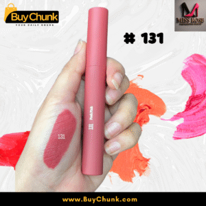 A close-up of a hand swatched with Miss Rose Matte Lip Gloss Shade 131, showing the rich rosy-red color, with the lip gloss tube being held.