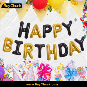 Black and gold happy birthday foil balloons on yellow background.