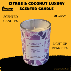 Citrus and Coconut Luxury Scented Candle in glass jar on wooden table.