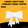 Elegant white bow topper on clear tumbler straw outdoors