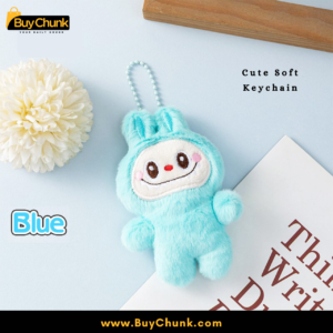 Labubu blue plush bag charm held in hand, lightweight and compact.