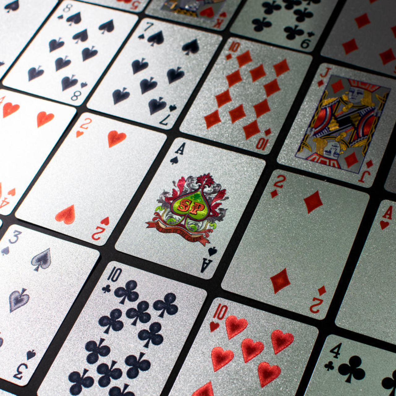 Imported Silver Dollar Playing Cards Premium Quality – Waterproof Deck | Durable Shiny Cards for Family Fun in Pakistan 4 Hand holding silver waterproof playing cards with clear red heart symbols