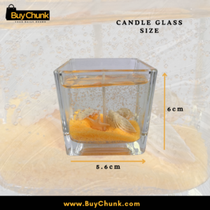 Decorative orange gel candle featuring seashell details and warm ambient home lighting